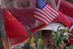 The U.S. and China announce a deal to cut tariffs, temporarily easing trade war